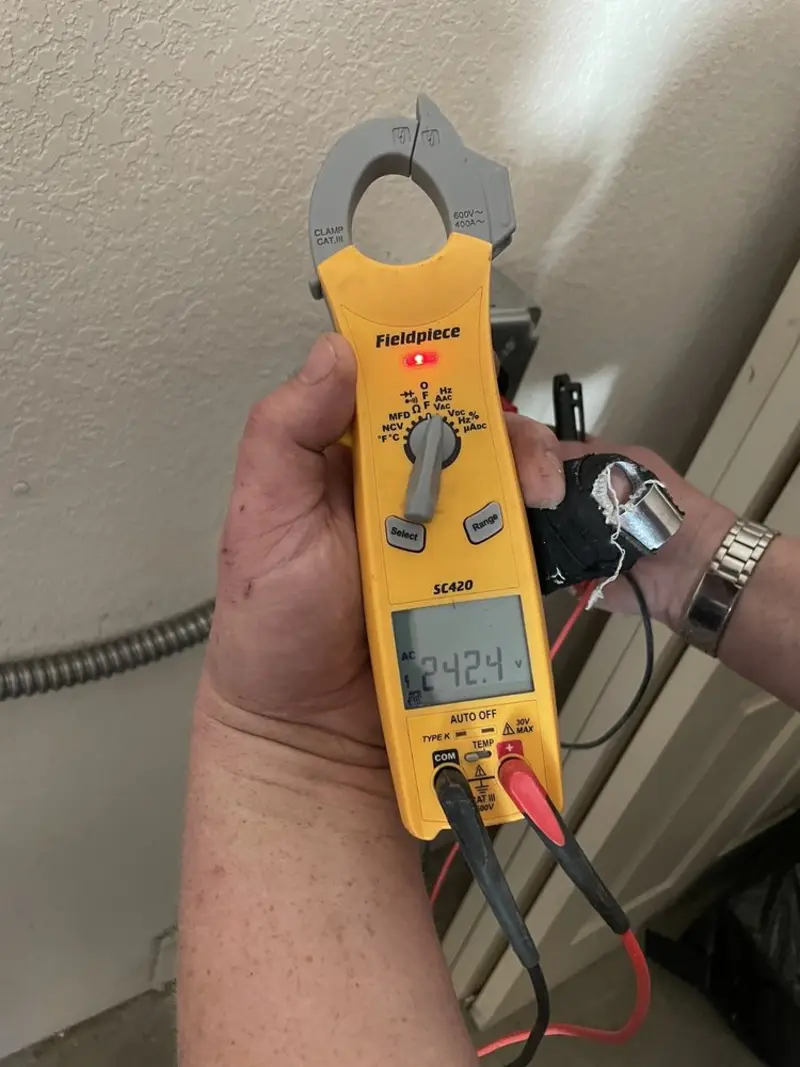 Voltage testing with clamp meter during Circuit Breaker Repair in Bow